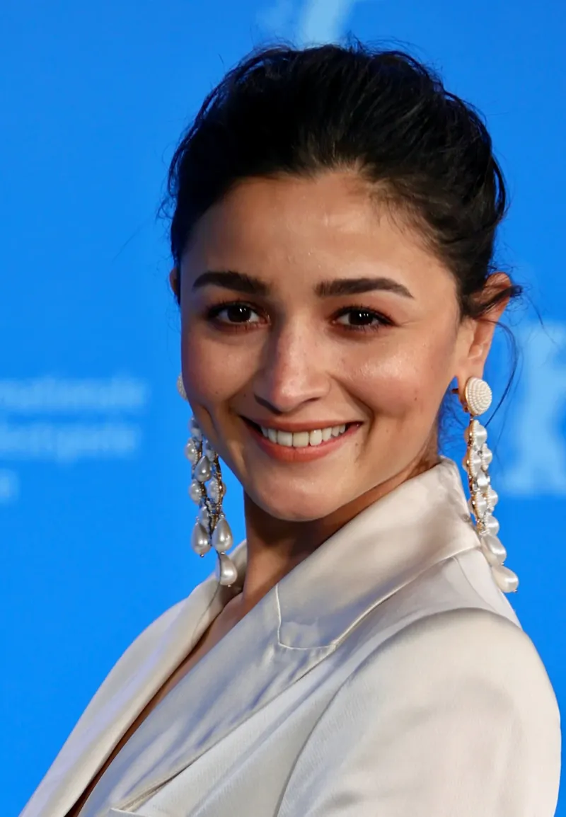Alia Bhatt wearing cool jewel-toned gowns with sharp contrast, showcasing glacier blue, raspberry, graphite, arctic white, and ultra black from the Cool Winter palette.