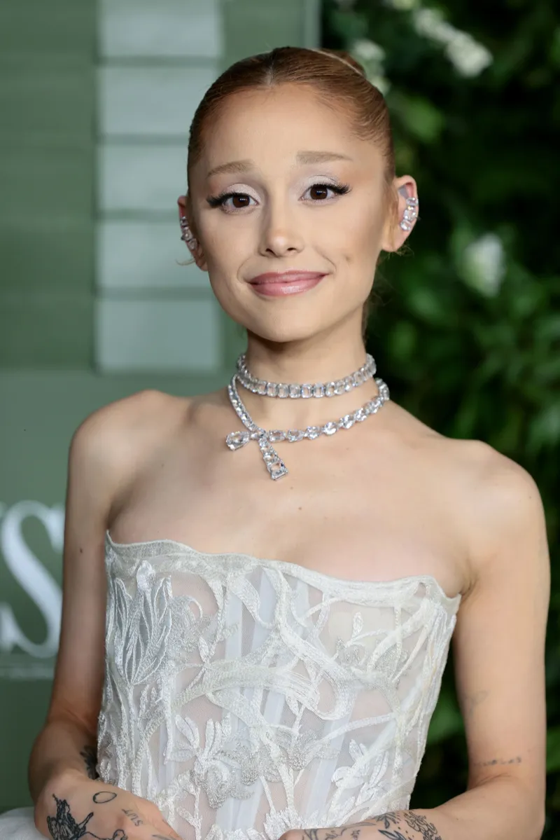 Editorial gallery of Ariana Grande styled in bright winter looks with electric blues, magenta accents, and polished black, highlighting optic white, black cherry, icy lavender, silver, and cotton-candy pink.