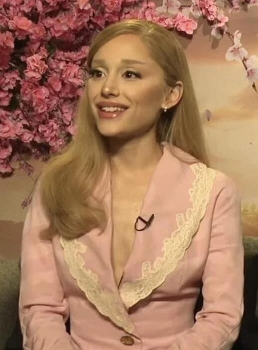 Ariana Grande wearing jewel-toned statement dressing with crisp contrast and sparkle, showcasing optic white, black cherry, icy lavender, silver, and cotton-candy pink from the Bright Winter palette.