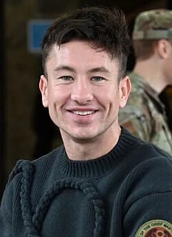 Editorial gallery of Barry Keoghan styled in warm spring looks packed with coral, turquoise, and golden accents, highlighting papaya orange, sunny marigold, aqua turquoise, creamy ivory, and rose gold.