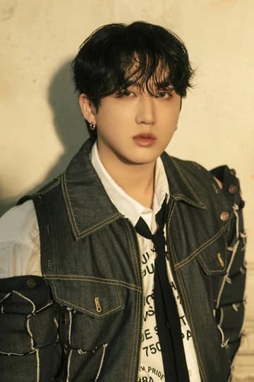 Editorial gallery of Changbin (Stray Kids) styled in cool winter outfits featuring sapphire, amethyst, and inky neutrals, highlighting glacier blue, raspberry, graphite, arctic white, and ultra black.