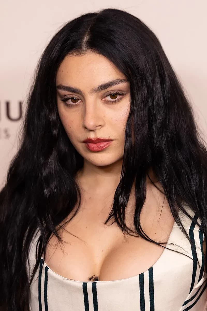 Charli XCX wearing jewel-toned statement dressing with crisp contrast and sparkle, showcasing electric cobalt, icy magenta, optic white, chrome silver, and inky black from the Bright Winter palette.