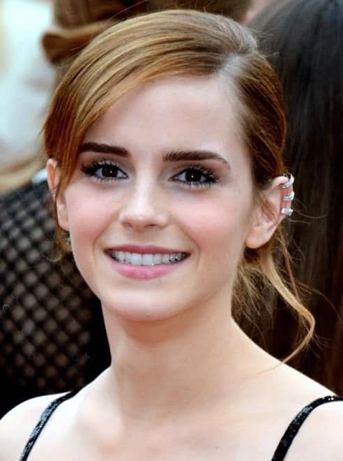 Emma Watson wearing velvety pastel looks with cool-muted tones, showcasing heather gray, dusty mauve, mist blue, slate green, and antique silver from the Soft Summer palette.