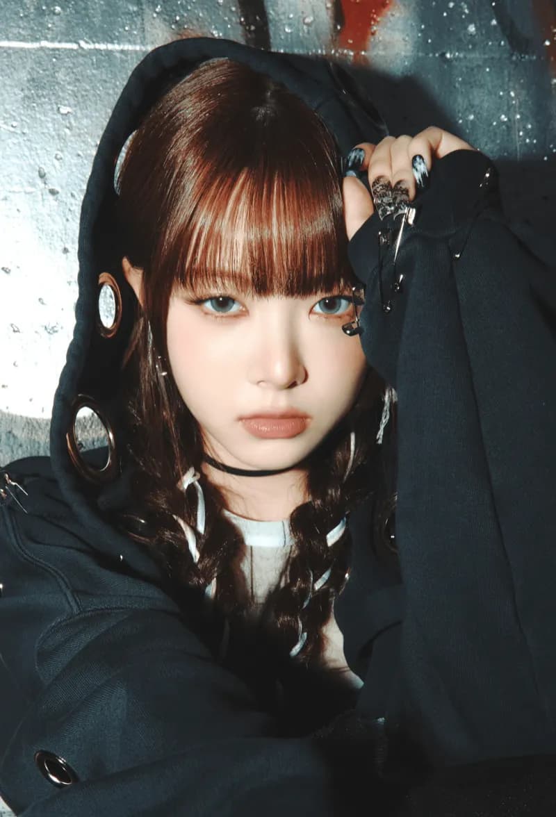 Eunchae (LE SSERAFIM) wearing jewel-toned statement dressing with crisp contrast and sparkle, showcasing electric cobalt, icy magenta, optic white, chrome silver, and inky black from the Bright Winter palette.