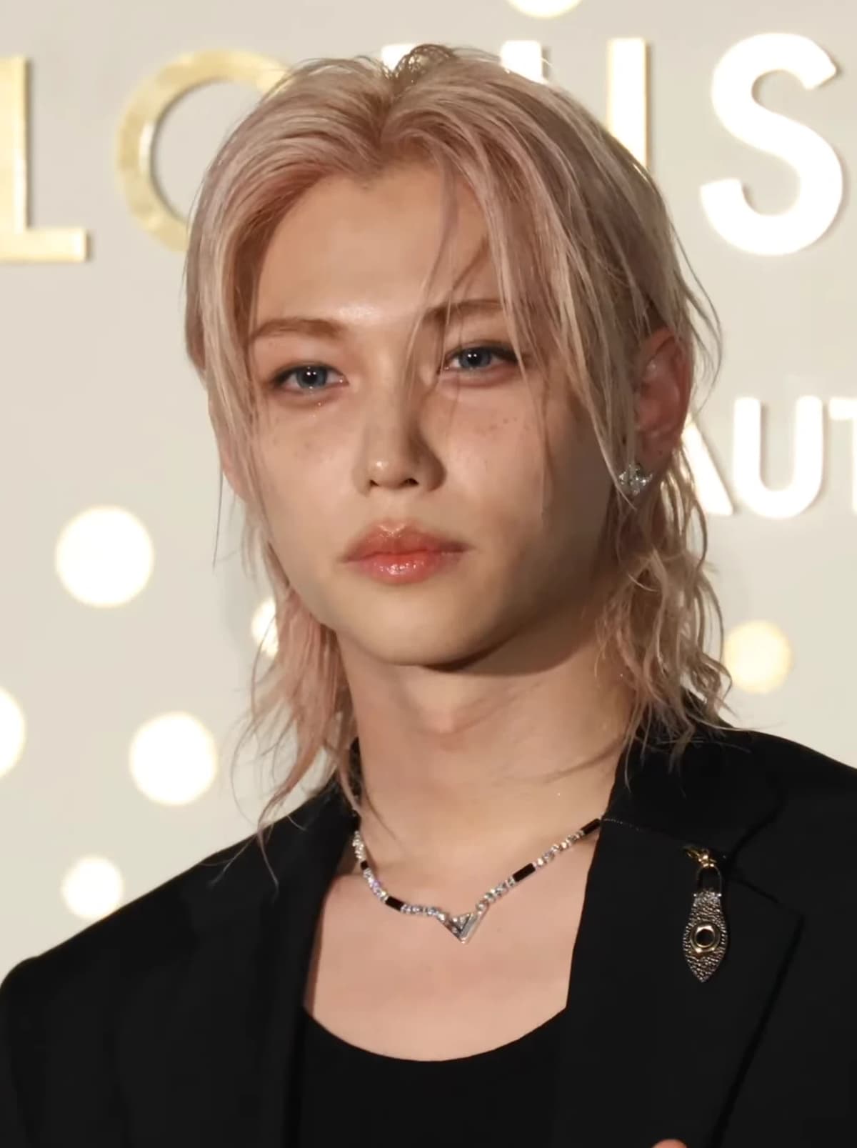 Felix (Stray Kids) wearing deep jewel-toned ensembles with sharp contrast, showcasing midnight navy, crimson, amethyst, gunmetal, and snow white from the Deep Winter palette.