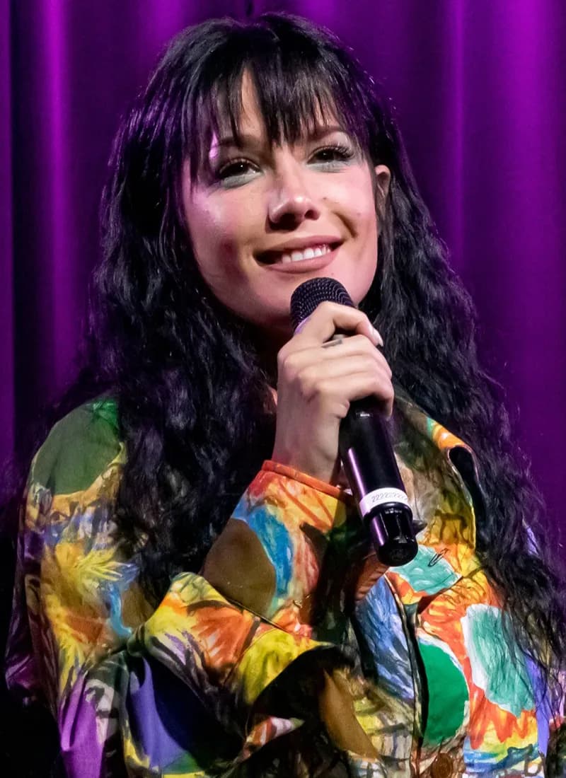 Halsey wearing deep jewel-toned ensembles with sharp contrast, showcasing midnight navy, crimson, amethyst, gunmetal, and snow white from the Deep Winter palette.