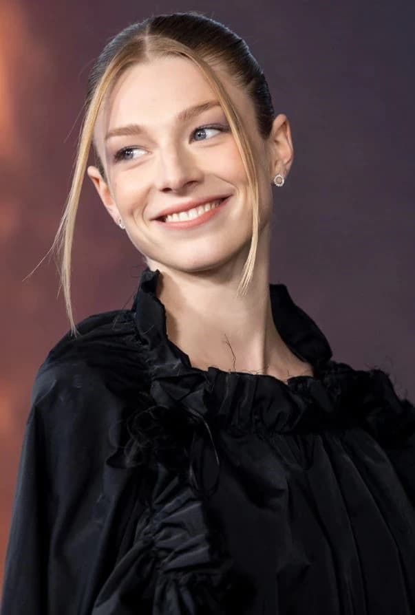 Editorial gallery of Hunter Schafer styled in cool winter outfits featuring sapphire, amethyst, and inky neutrals, highlighting ice blue, silver, lavender, black, and electric violet.