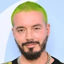 Editorial gallery of J Balvin styled in bold winter ensembles mixing neon pops, inky black, and chrome sparkle, highlighting ultra violet, neon fuchsia, electric jade, polished pewter, and onyx.