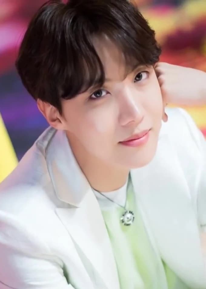 Editorial gallery of J-Hope (BTS) styled in cool winter outfits featuring sapphire, amethyst, and inky neutrals, highlighting glacier blue, raspberry, graphite, arctic white, and ultra black.