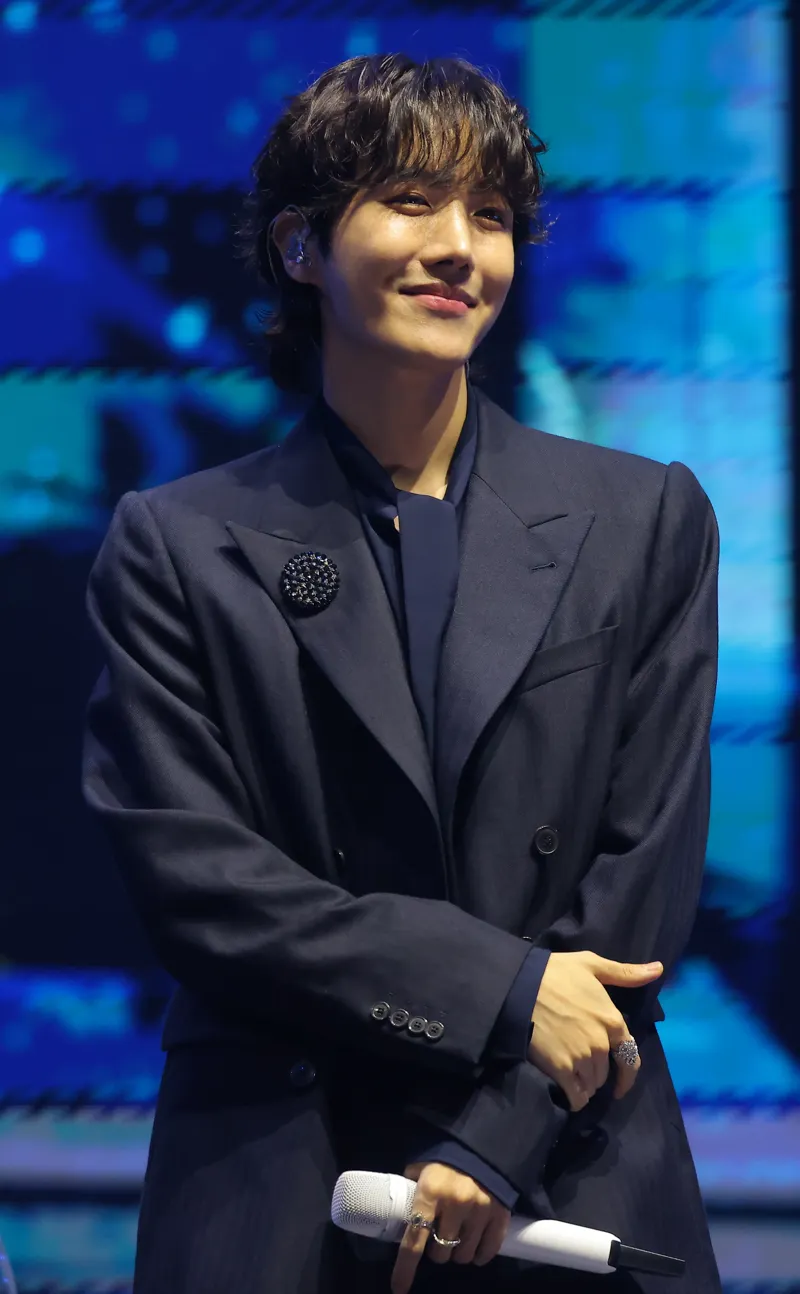 J-Hope (BTS) wearing cool jewel-toned gowns with sharp contrast, showcasing glacier blue, raspberry, graphite, arctic white, and ultra black from the Cool Winter palette.
