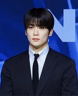 Jaehyun (NCT) wearing cool jewel-toned gowns with sharp contrast, showcasing glacier blue, raspberry, graphite, arctic white, and ultra black from the Cool Winter palette.
