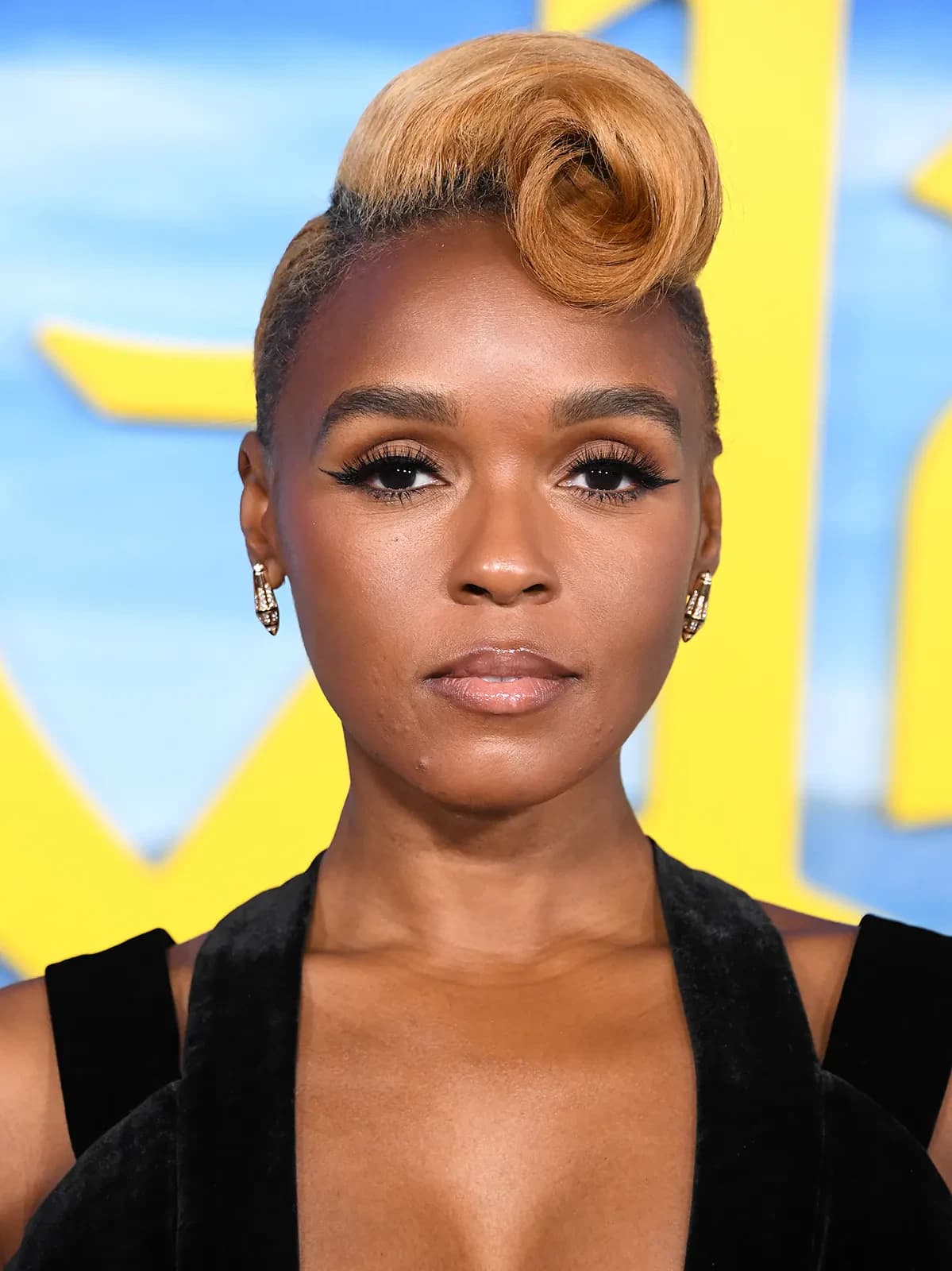 Editorial gallery of Janelle Monáe styled in light summer outfits blending powder blues, lilac, and silvery neutrals, highlighting sky blue, cool blush, opal gray, mint chiffon, and soft navy.
