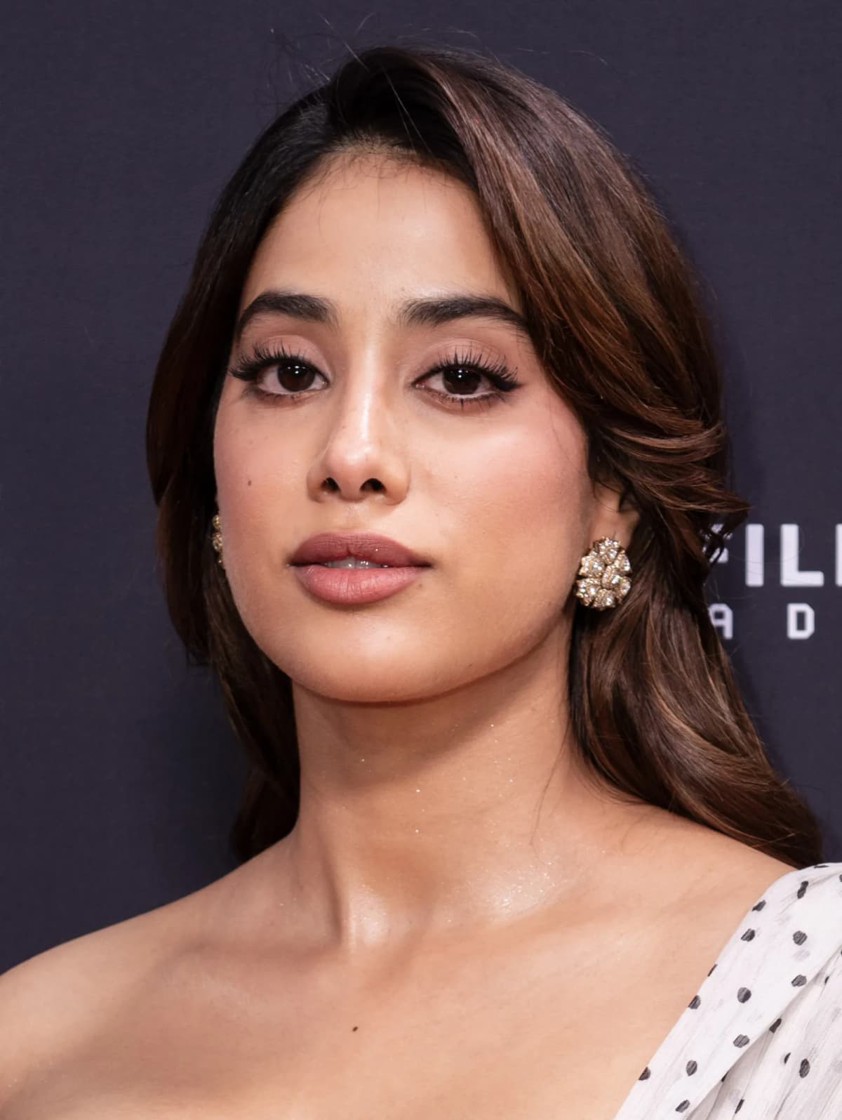 Janhvi Kapoor wearing sun-soaked autumn looks with rich neutrals and texture, showcasing marigold glaze, terra cotta, emerald velvet, soft coral, and gilded bronze from the Warm Autumn palette.