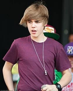 Editorial gallery of Justin Bieber styled in vibrant winter looks mixing neon brights, sharp blacks, and metallic shine, highlighting fuchsia, royal blue, silver chrome, acid lime, and deep plum.