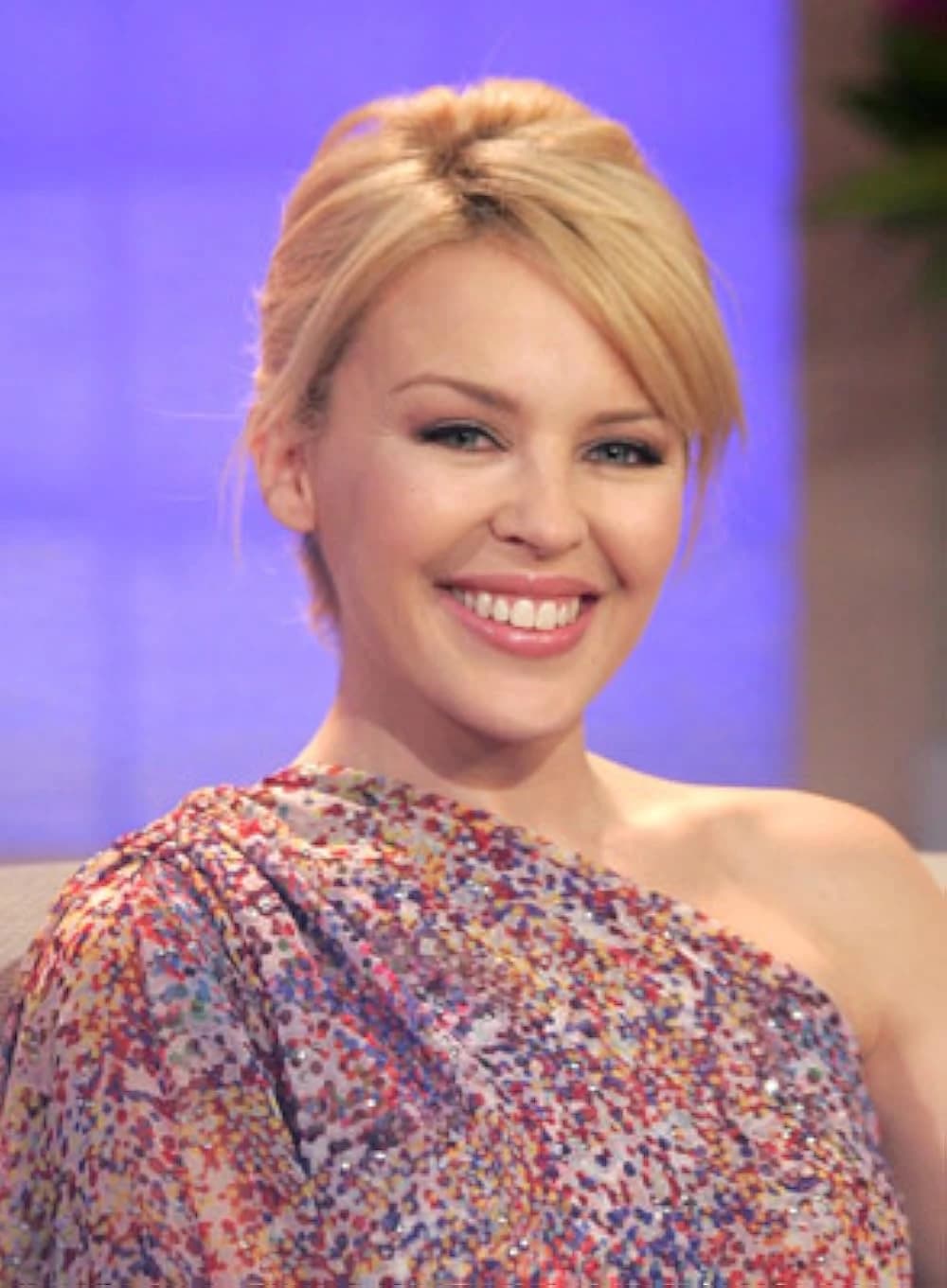 Editorial gallery of Kylie Minogue styled in soft spring wardrobes featuring peach, mint, and buttery neutrals, highlighting peach sorbet, seafoam, buttercream, leafy green, and rose beige.