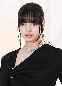 Lisa (BLACKPINK) wearing jewel-toned statement dressing with crisp contrast and sparkle, showcasing neon fuchsia, electric blue, optic white, chrome, and jet black from the Bright Winter palette.