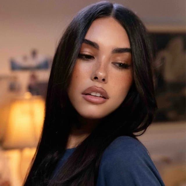 Madison Beer wearing moody jewel-toned outfits with softened contrast, showcasing charcoal, dusty mauve, wine, soft black, and frosted pink from the Soft Winter palette.