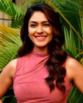 Mrunal Thakur wearing sun-soaked autumn looks with rich neutrals and texture, showcasing burnt sienna, olive green, mustard gold, peach amber, and dark chocolate from the Warm Autumn palette.