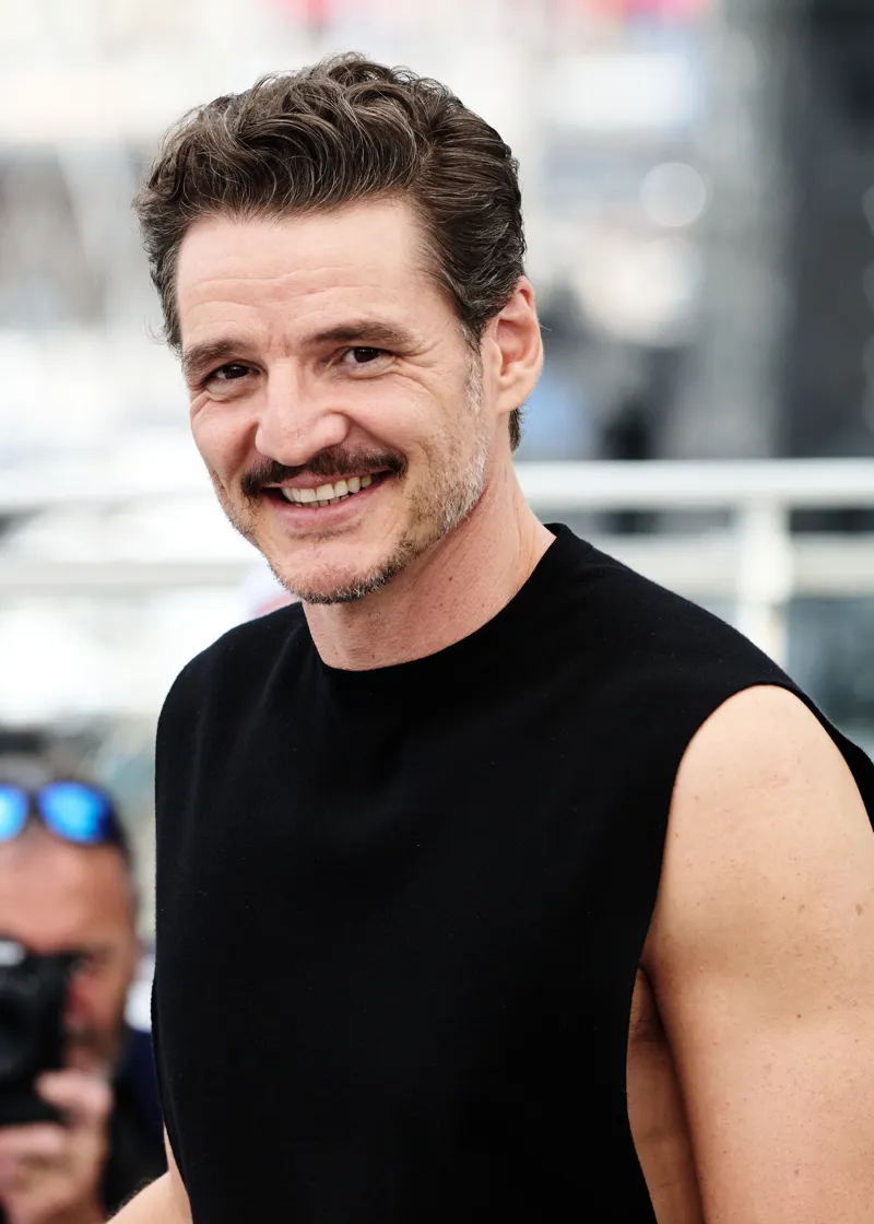 Pedro Pascal wearing grounded autumn looks with rich neutrals and subtle shimmer, showcasing cedar brown, sage moss, warm taupe, terracotta, and antique gold from the Neutral Autumn palette.