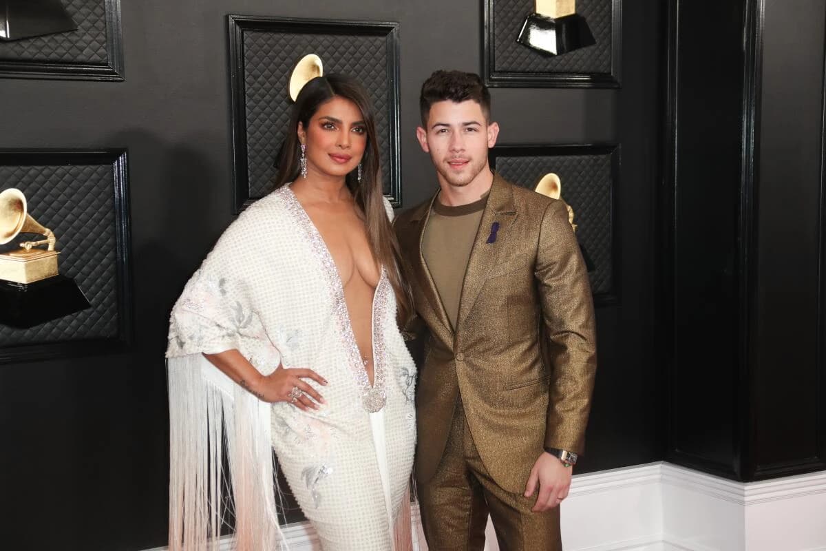 Editorial gallery of Priyanka Chopra Jonas styled in deep winter looks featuring sapphire, garnet, and chrome accents, highlighting sapphire, royal purple, ruby, midnight teal, and gunmetal.