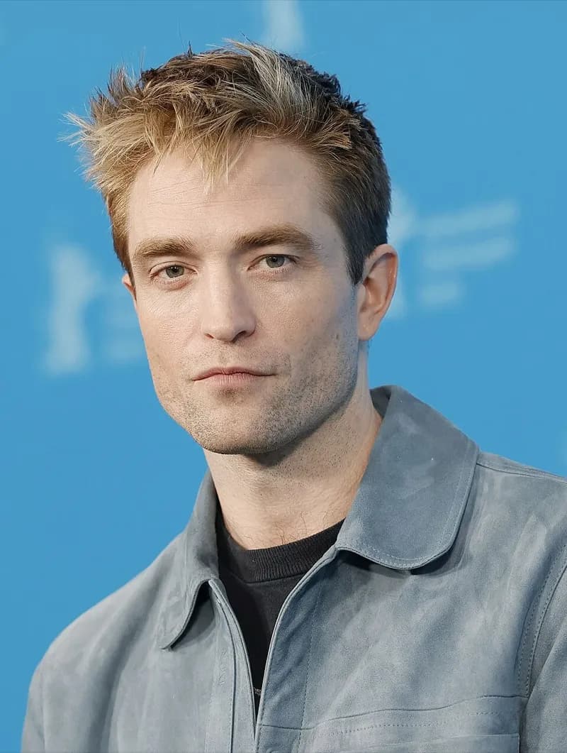 Robert Pattinson wearing velvety pastel looks with cool-muted tones, showcasing heather gray, dusty mauve, mist blue, slate green, and antique silver from the Soft Summer palette.