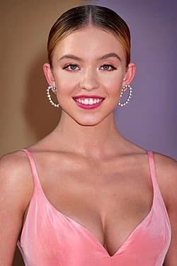 Editorial gallery of Sydney Sweeney styled in warm spring looks packed with coral, turquoise, and golden accents, highlighting champagne, sherbet peach, cornflower blue, rose gold, and warm ivory.