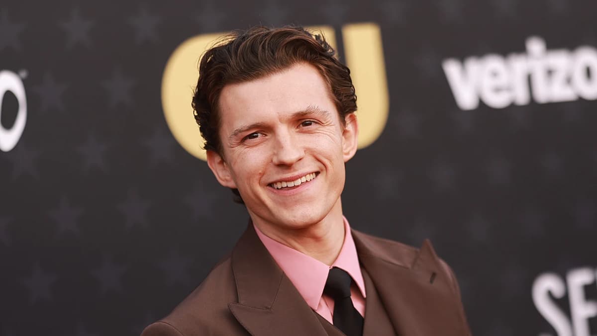 Editorial gallery of Tom Holland styled in light summer outfits blending powder blues, lilac, and silvery neutrals, highlighting sky blue, cool blush, opal gray, mint chiffon, and soft navy.