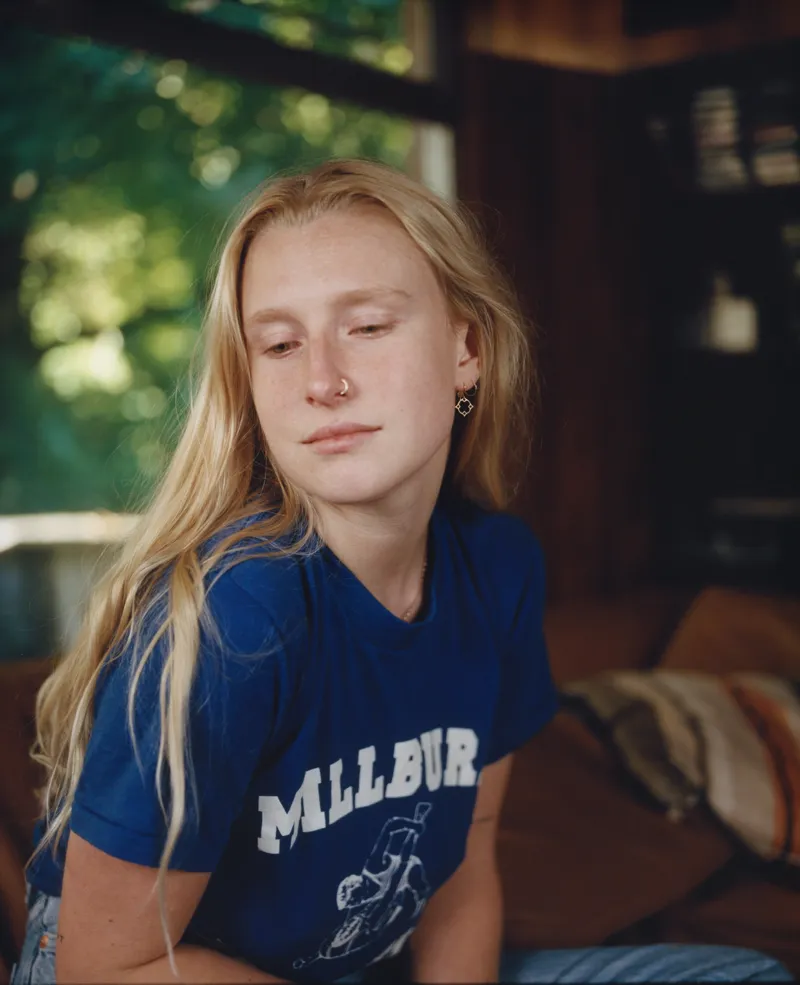 Billie Marten wearing glowing pastel outfits with warm undertones, showcasing peach sorbet, seafoam, buttercream, leafy green, and rose beige from the Soft Spring palette.