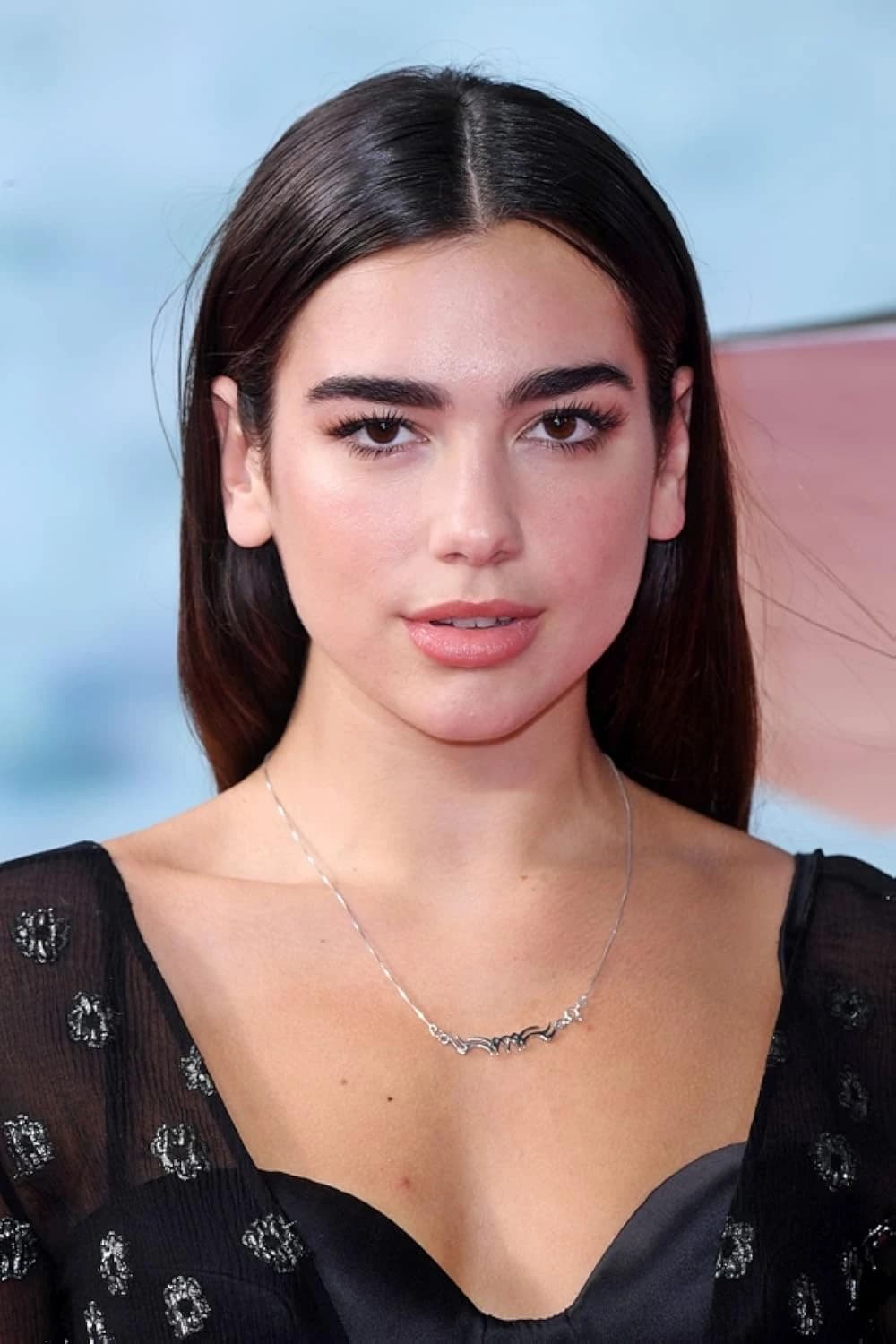 Dua Lipa — Deep Winter styling | Palette Hunt Editorial gallery of Dua Lipa styled in deep winter looks featuring sapphire, garnet, and chrome accents, highlighting electric cobalt, amethyst, gunmetal, crimson, and ultra black.