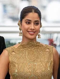 Editorial gallery of Janhvi Kapoor styled in warm autumn wardrobes featuring amber, moss, and bronze metals, highlighting marigold glaze, terra cotta, emerald velvet, soft coral, and gilded bronze.