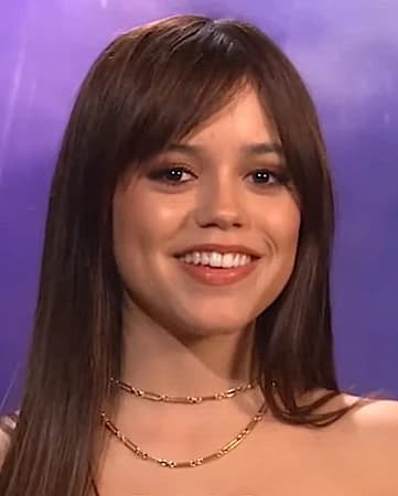 Jenna Ortega — Deep Winter styling | Palette Hunt Editorial gallery of Jenna Ortega styled in deep winter looks featuring sapphire, garnet, and chrome accents, highlighting ink black, deep plum, white lace, burgundy, and midnight navy.