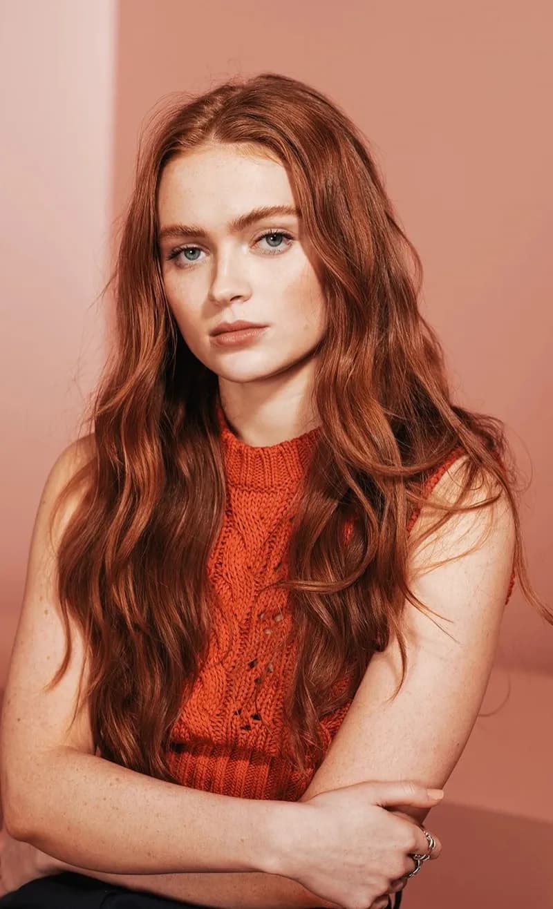 Sadie Sink — Vibrant Autumn styling | Palette Hunt Editorial gallery of Sadie Sink styled in vibrant autumn outfits featuring saffron, teal, and gold hardware, highlighting tangerine, teal, copper, brick red, and warm ivory.