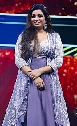 Shreya Ghoshal wearing muted autumn ensembles with velvety textures and gentle warmth, showcasing warm rose, muted teal, honey beige, sage, and antique gold from the Soft Autumn palette.