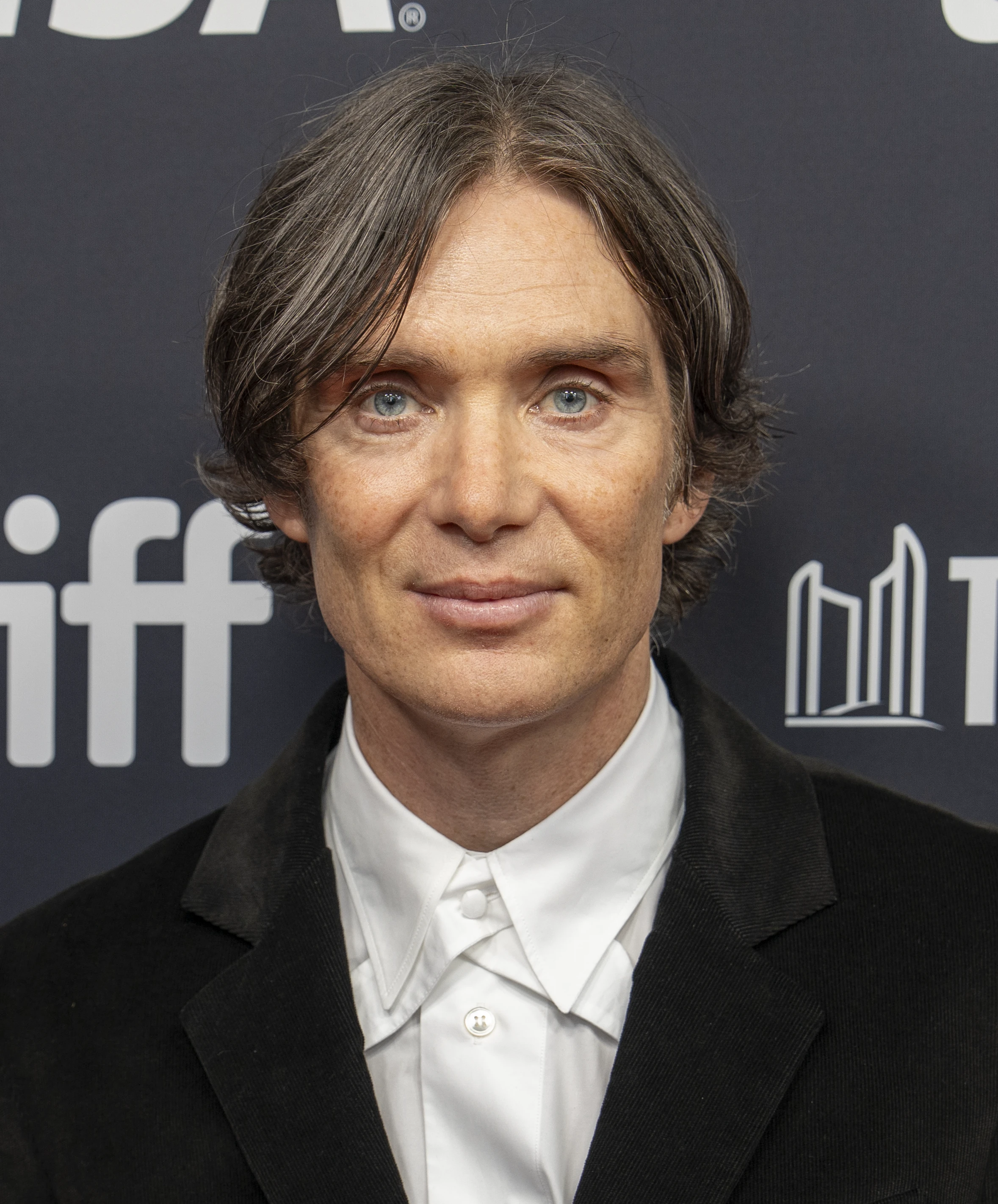 Cillian Murphy wearing airy pastel ensembles with soft tailoring, showcasing sky blue, cool blush, opal gray, mint chiffon, and soft navy from the Light Summer palette.