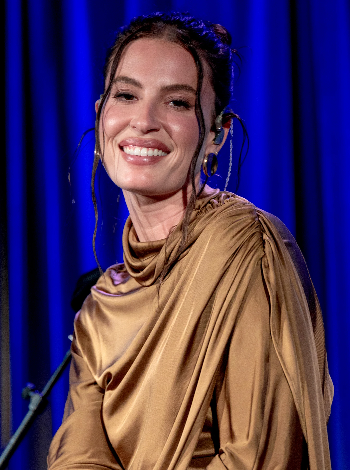 FLETCHER wearing jewel-toned statement dressing with crisp contrast and sparkle, showcasing electric cobalt, icy magenta, optic white, chrome silver, and inky black from the Bright Winter palette.