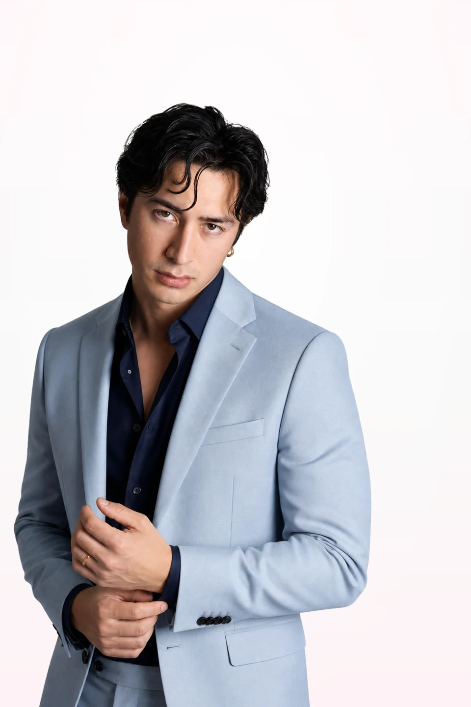 Editorial portrait of Hudson Williams testing cool, deep colors from a proposed Deep Winter palette.