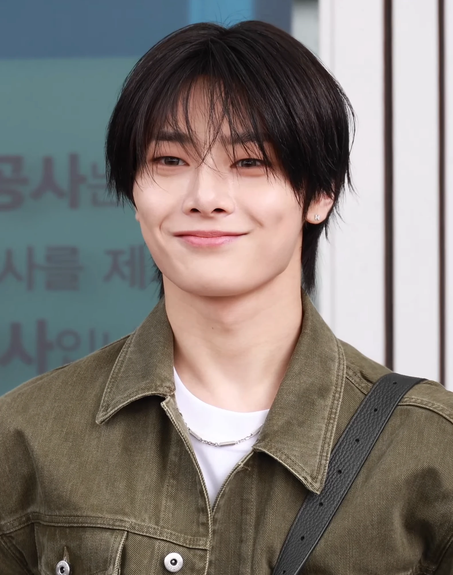 I.N (Stray Kids) wearing high-contrast electric brights paired with sharp tailoring, showcasing ultra violet, neon fuchsia, electric jade, polished pewter, and onyx from the Bold Winter palette.