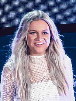 Kelsea Ballerini wearing velvety pastel looks with cool-muted tones, showcasing heather gray, dusty mauve, mist blue, slate green, and antique silver from the Soft Summer palette.