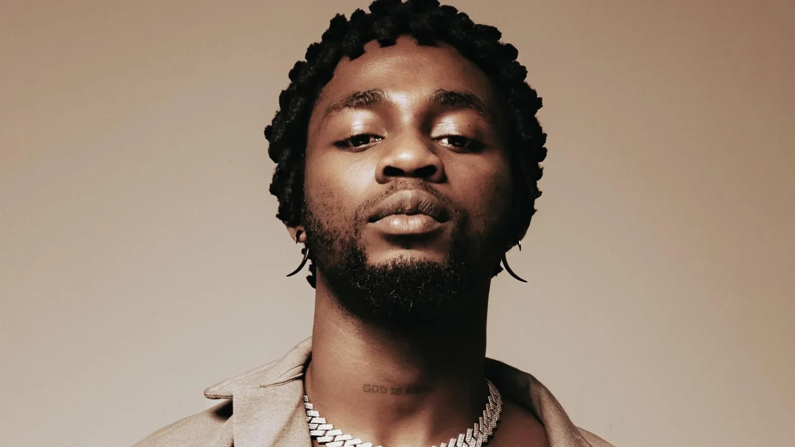 Omah Lay wearing saturated autumn looks with molten metallics, showcasing burnt sienna, chartreuse, emerald, molten gold, and espresso from the Vibrant Autumn palette.