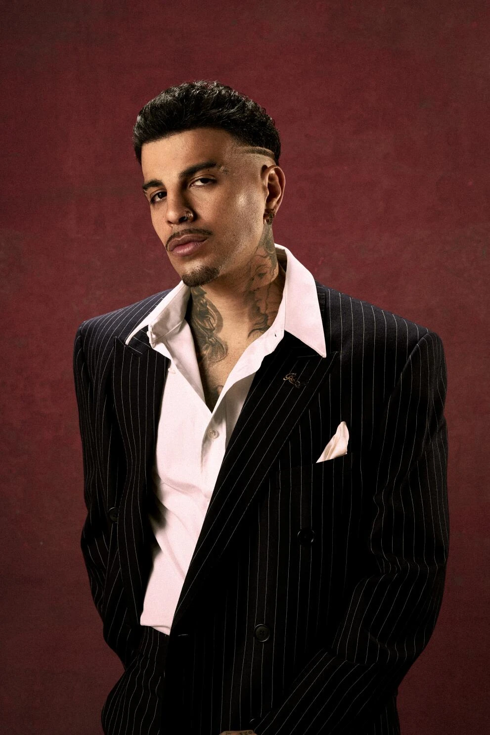 Rauw Alejandro wearing velvety pastel looks with cool-muted tones, showcasing heather gray, dusty mauve, mist blue, slate green, and antique silver from the Soft Summer palette.