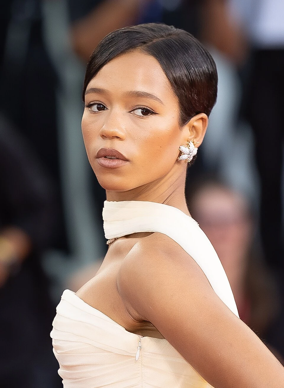 Taylor Russell wearing cool-toned looks with berry accents and fluid movement, showcasing powder blue, soft lilac, rose quartz, silvery sage, and midnight plum from the True Summer palette.