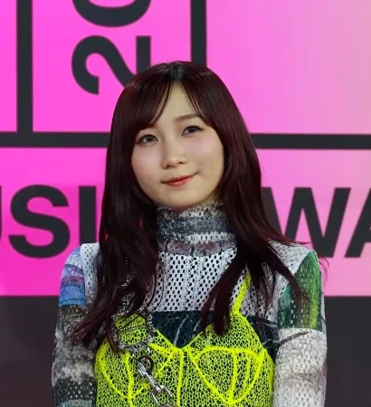 YOASOBI (Ikura) wearing muted autumn ensembles with velvety textures and gentle warmth, showcasing desert rose, sage green, oatmeal, copper brown, and soft teal from the Soft Autumn palette.