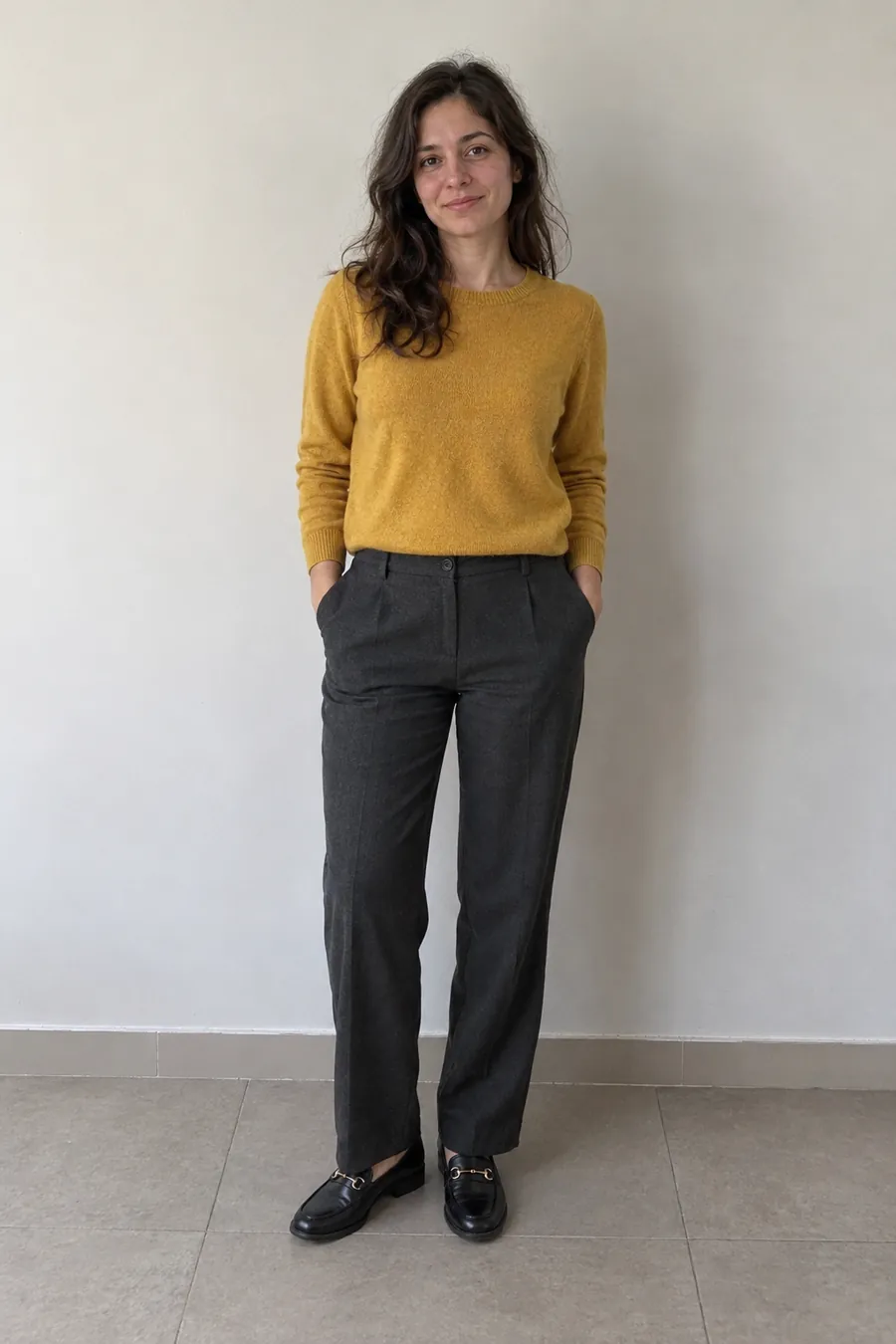 Mustard knit sweater with charcoal trousers