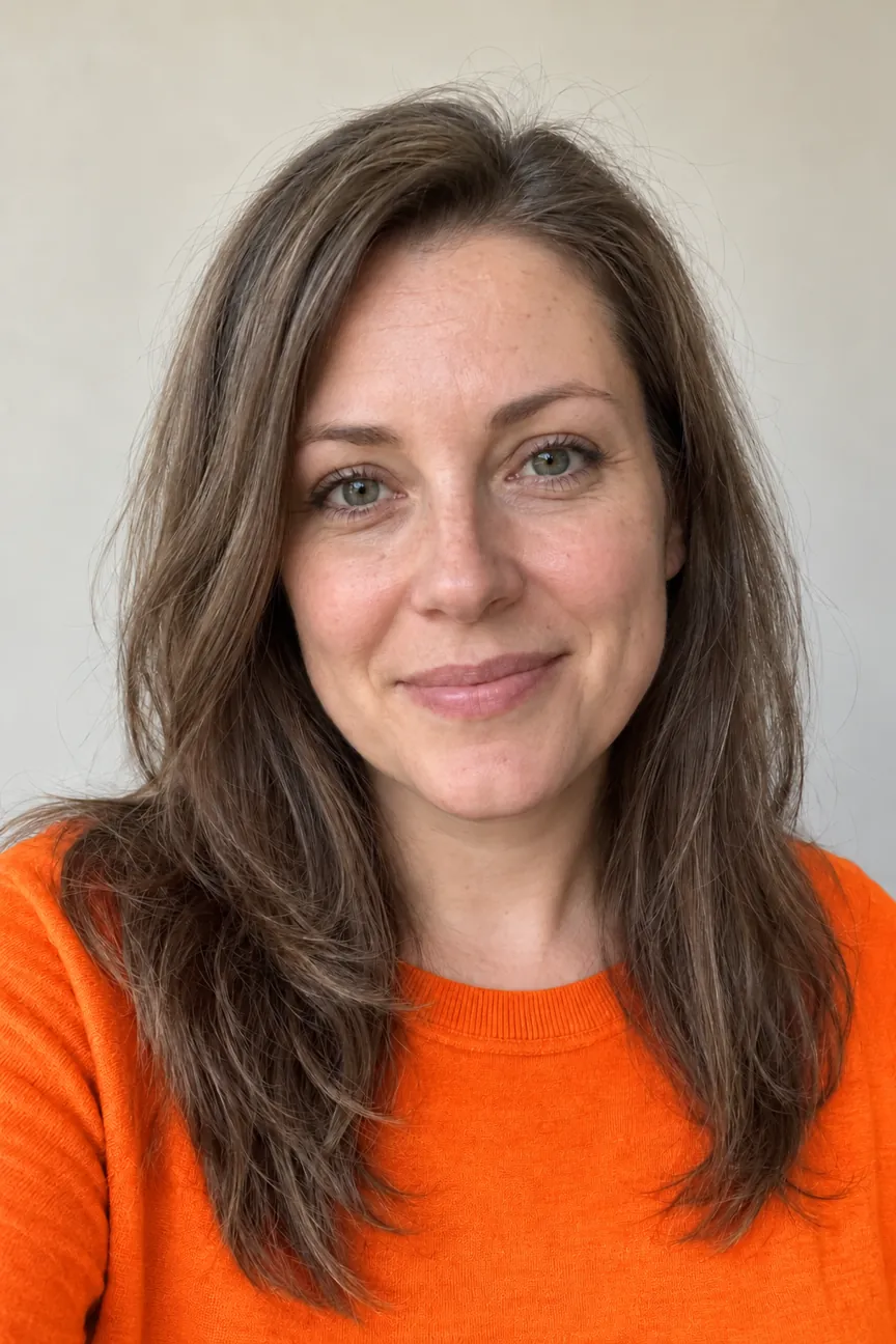 The same Soft Summer woman wearing bright orange, a color to avoid